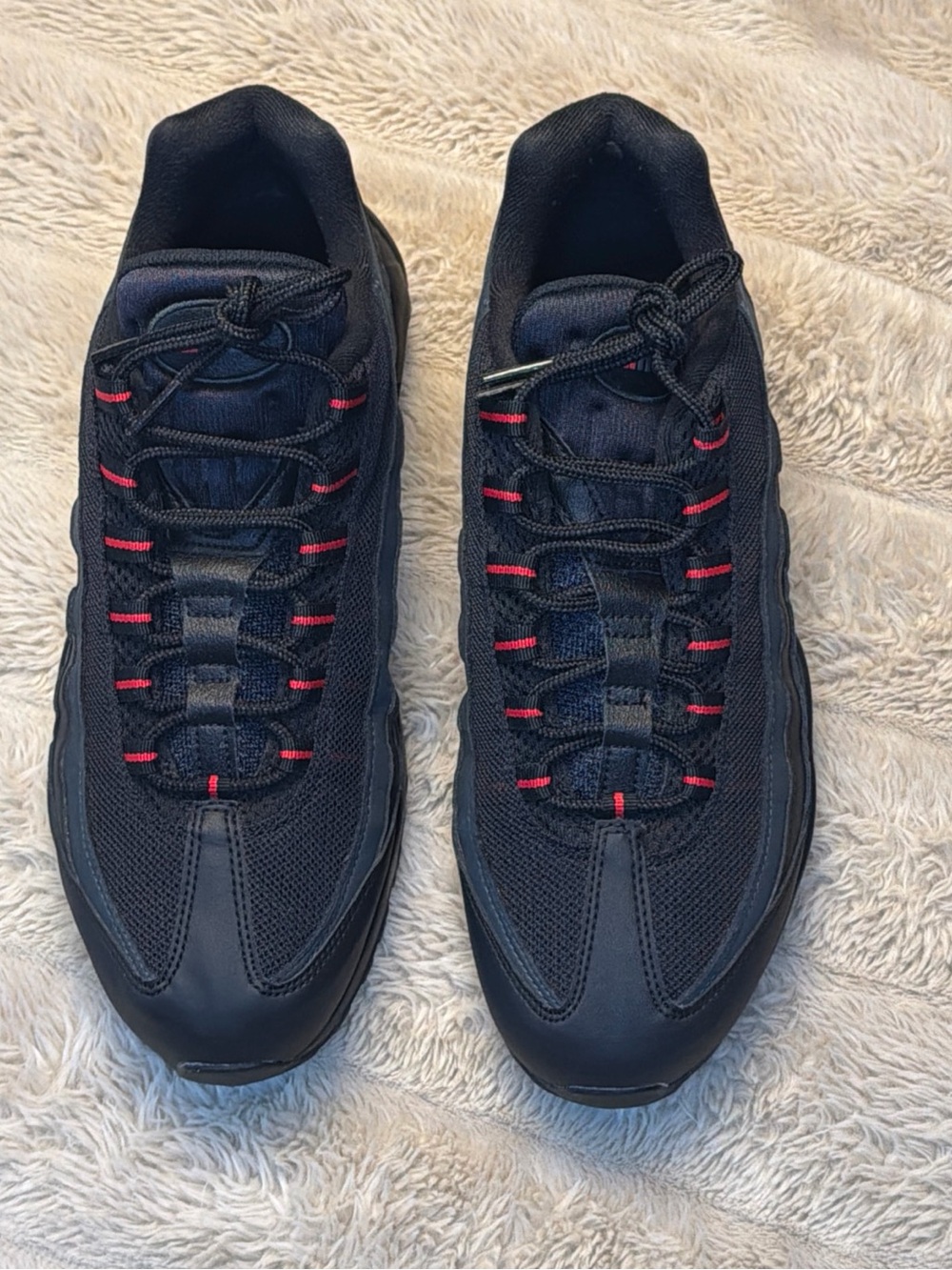 Nike Black Sneakers with Red Lace Accents